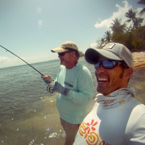 Guide Davin with Client Hooked up to Cayman Bonefish